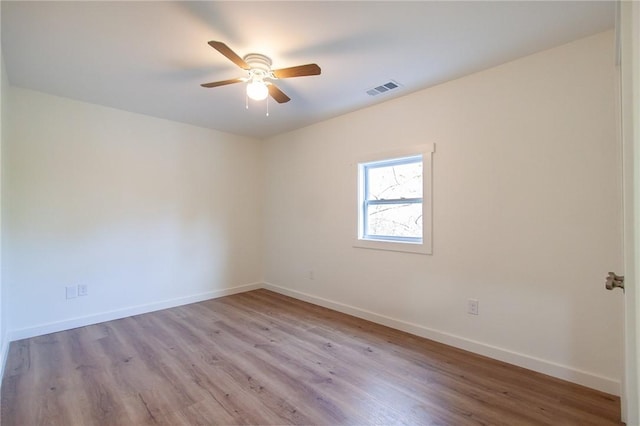 762 Lee Road 197, Phenix City, AL 36870 - unfurnished room with wood finished floors, baseboards, visible vents, and ceiling fan