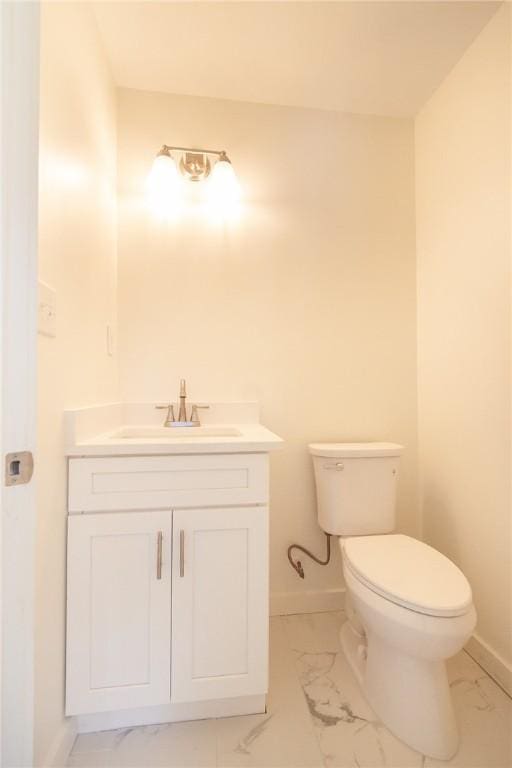 762 Lee Road 197, Phenix City, AL 36870 - bathroom featuring marble finish floor, toilet, vanity, and baseboards