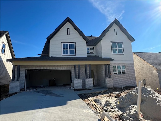 view of front of house with a porch and a garage