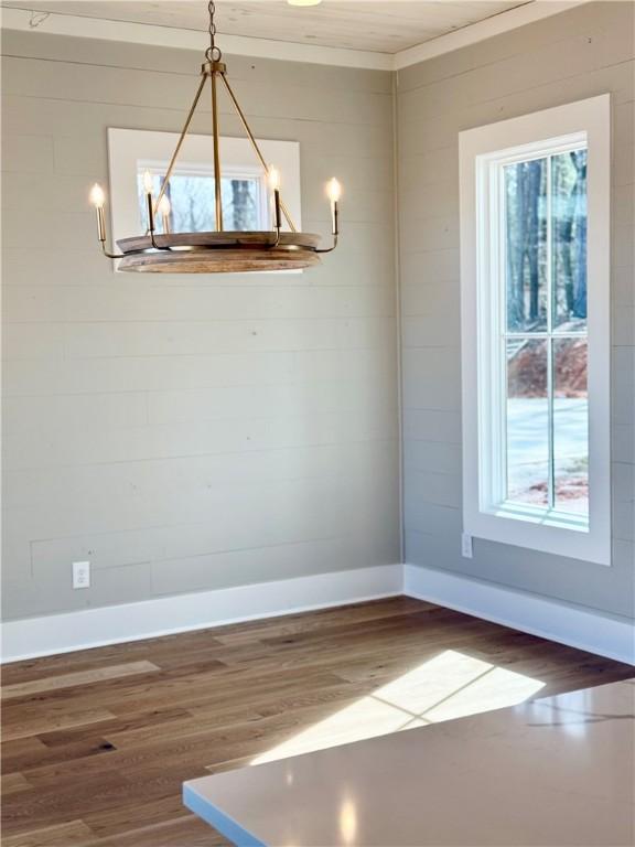 unfurnished dining area with dark hardwood / wood-style flooring