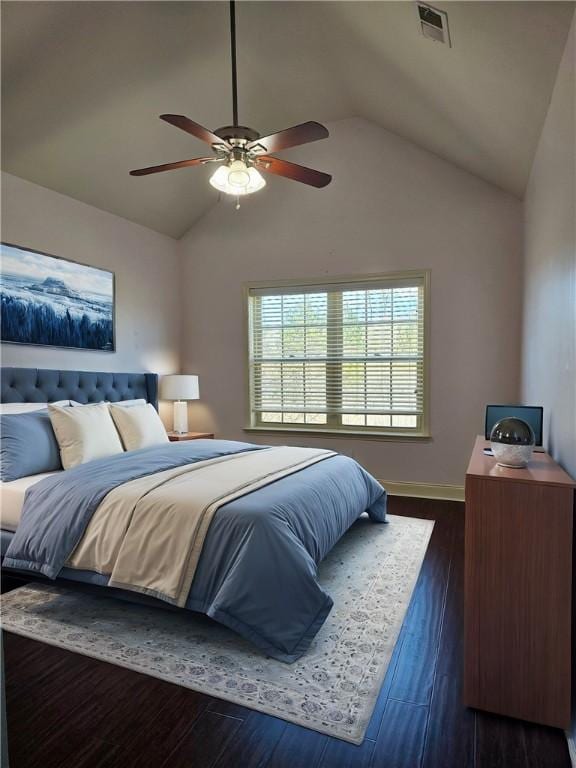 bedroom featuring visible vents, ceiling fan, baseboards, lofted ceiling, and dark wood-style floors