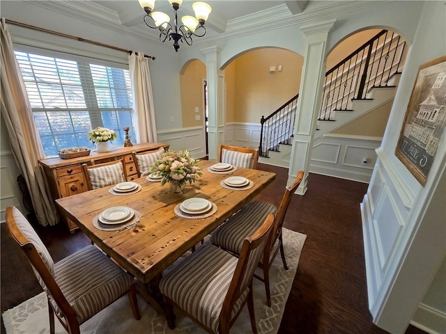 dining room with dark wood-type flooring, crown molding, stairs, arched walkways, and ornate columns