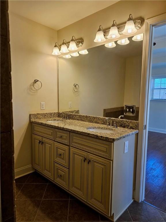 bathroom featuring a sink, double vanity, and tile patterned flooring