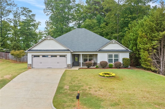 view of front of property with a front lawn and a garage