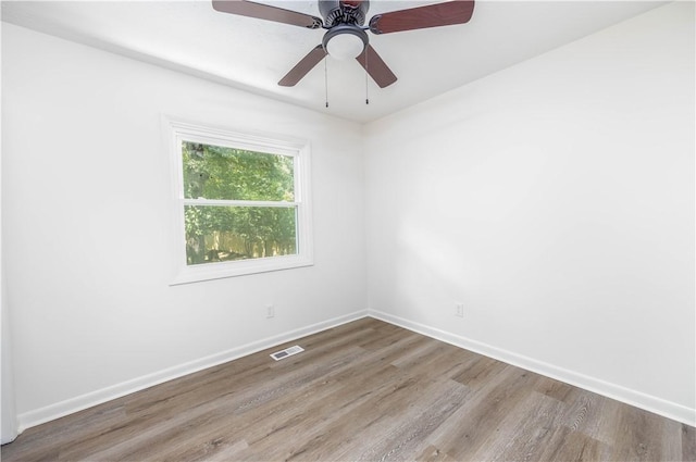 unfurnished room featuring ceiling fan and wood-type flooring