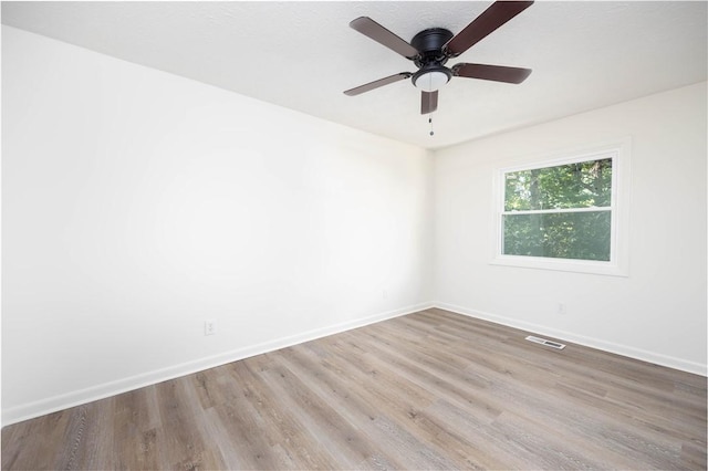 unfurnished room featuring ceiling fan and light hardwood / wood-style flooring