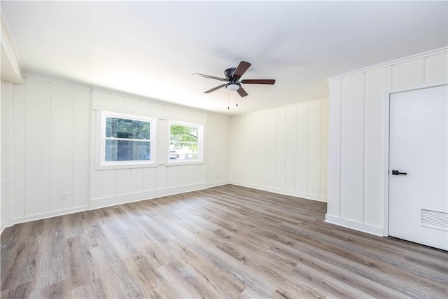 spare room with ceiling fan and light hardwood / wood-style floors