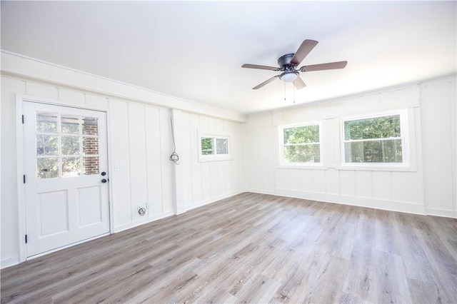 unfurnished room featuring ceiling fan and light hardwood / wood-style flooring