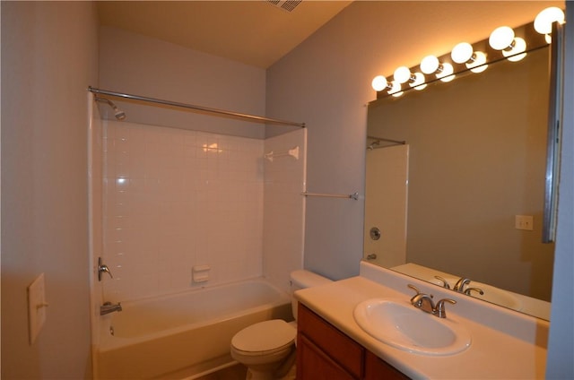 bathroom featuring vanity, toilet, and shower / washtub combination