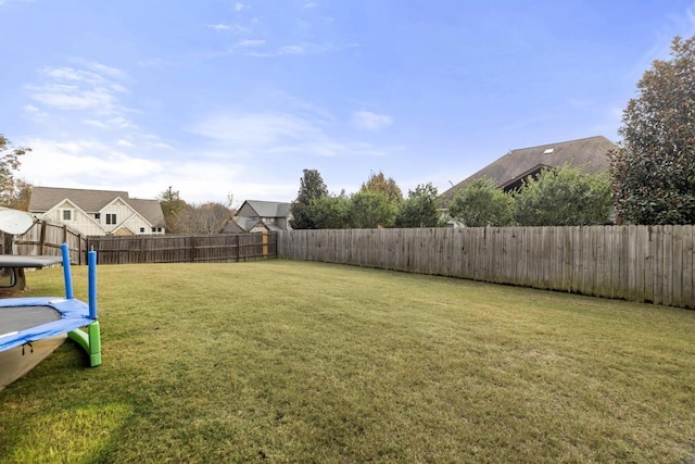 view of yard with a trampoline