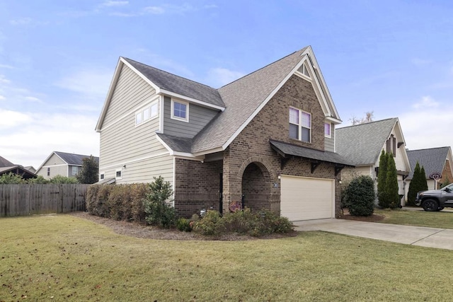 view of front facade featuring a garage and a front lawn