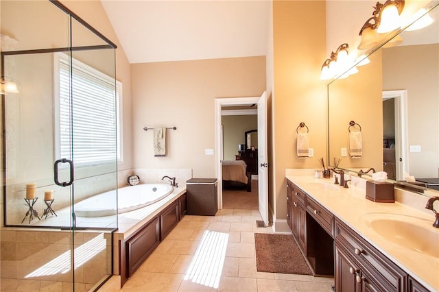 bathroom with tile patterned floors, vanity, lofted ceiling, and shower with separate bathtub