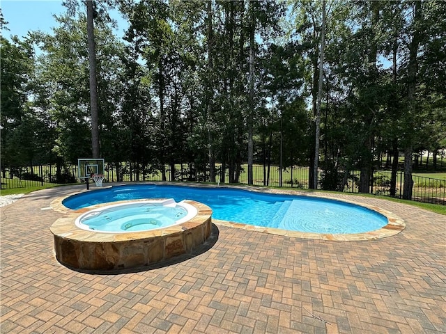1179 Still Hunt Ln, Auburn, AL 36832 - view of pool featuring an in-ground hot tub and view of wooded area