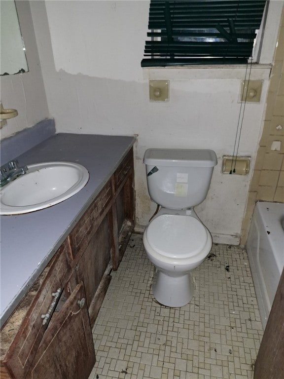full bath with toilet and vanity