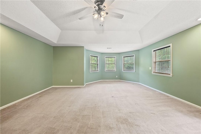 3519 Anderson Rd, Opelika, AL 36801 - empty room featuring a tray ceiling, carpet, a ceiling fan, and a textured ceiling