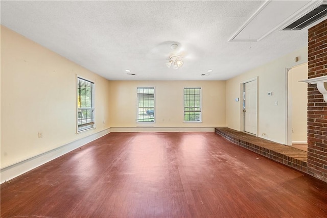 3519 Anderson Rd, Opelika, AL 36801 - empty room with attic access, wood finished floors, and a textured ceiling