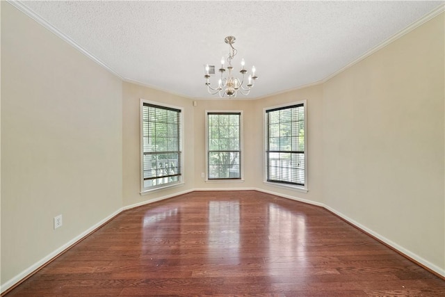 3519 Anderson Rd, Opelika, AL 36801 - empty room featuring ornamental molding, wood finished floors, a chandelier, and a textured ceiling