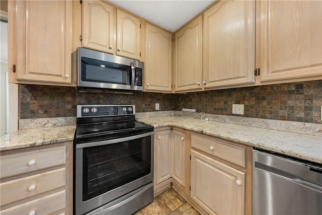 3519 Anderson Rd, Opelika, AL 36801 - kitchen with appliances with stainless steel finishes, light brown cabinets, backsplash, and light stone counters