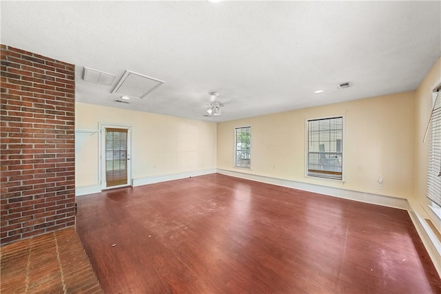 3519 Anderson Rd, Opelika, AL 36801 - unfurnished room with wood finished floors, attic access, and a ceiling fan