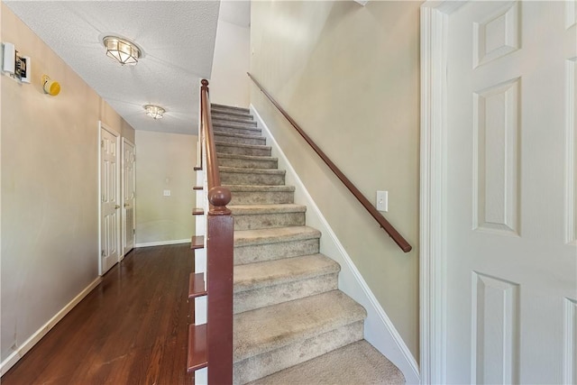 3519 Anderson Rd, Opelika, AL 36801 - stairs with wood finished floors and a textured ceiling