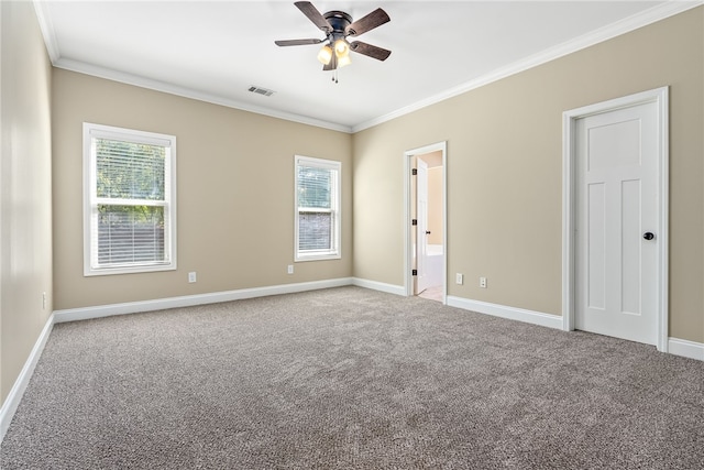 empty room featuring carpet flooring, ceiling fan, and ornamental molding