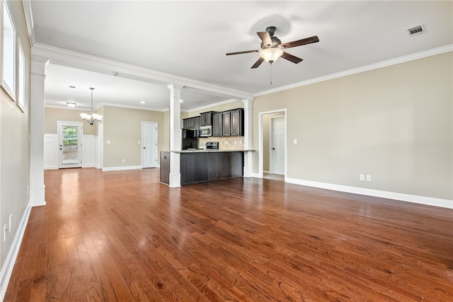 unfurnished living room featuring crown molding, ceiling fan with notable chandelier, and dark hardwood / wood-style floors