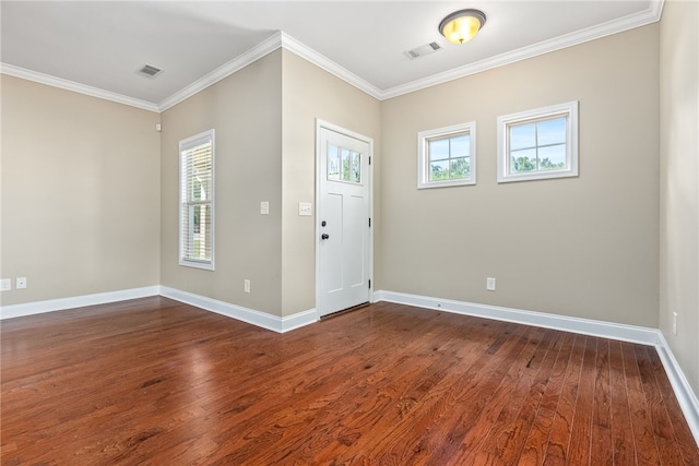 foyer featuring dark hardwood / wood-style floors and crown molding