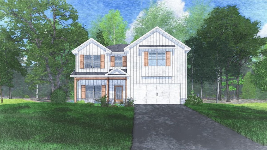 view of front facade featuring a front yard, a garage, and driveway