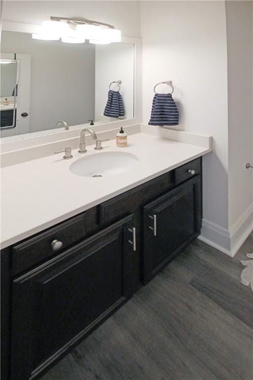 bathroom featuring hardwood / wood-style floors and vanity