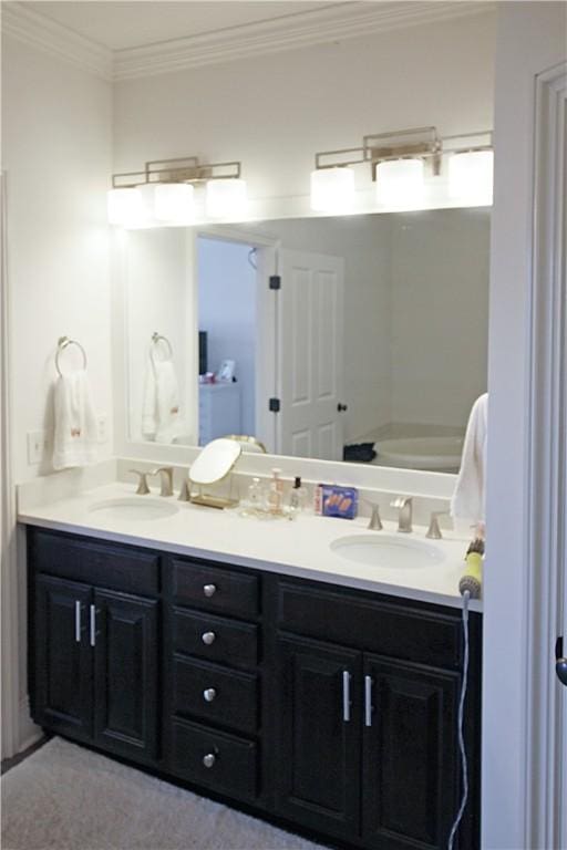 bathroom with vanity and ornamental molding