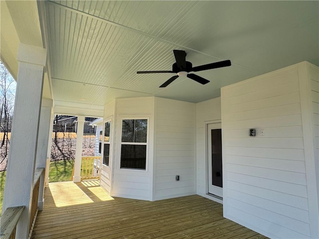 wooden terrace featuring ceiling fan