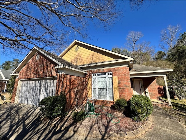 view of property exterior with brick siding and an attached garage