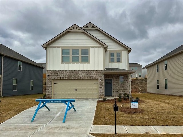 craftsman-style home with driveway, brick siding, board and batten siding, and an attached garage