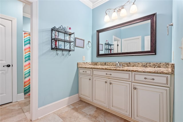 bathroom with crown molding and vanity