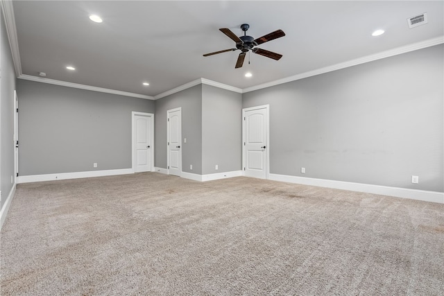 unfurnished room featuring carpet flooring, ceiling fan, and crown molding