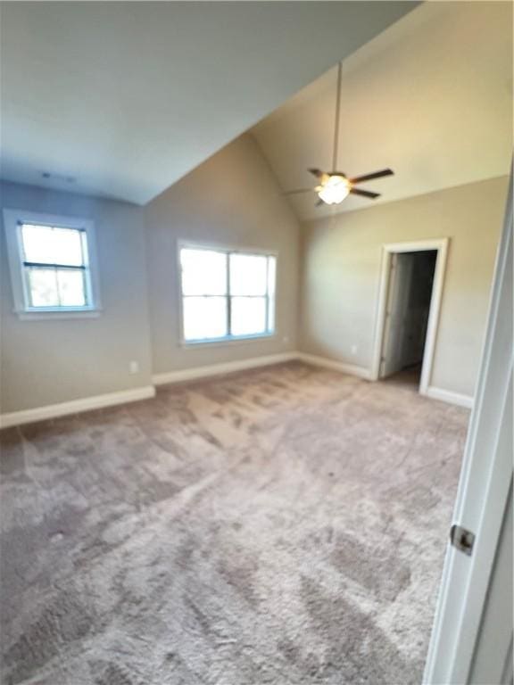 856 Violet Ln, Opelika, AL 36801 - carpeted spare room featuring vaulted ceiling, baseboards, and a ceiling fan