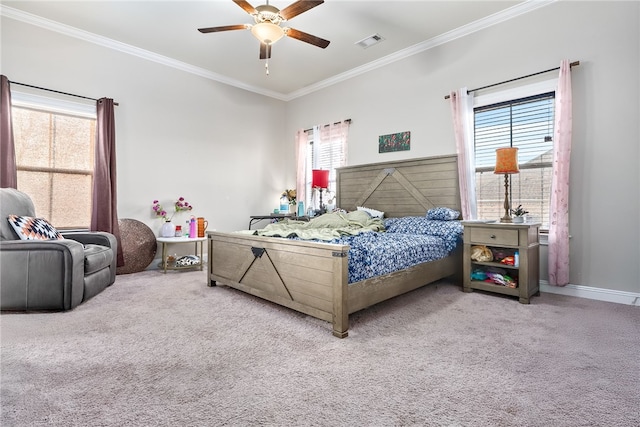 carpeted bedroom featuring ornamental molding, multiple windows, and visible vents