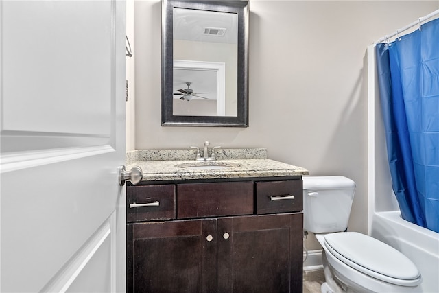 bathroom with visible vents, shower / bath combo, vanity, and toilet