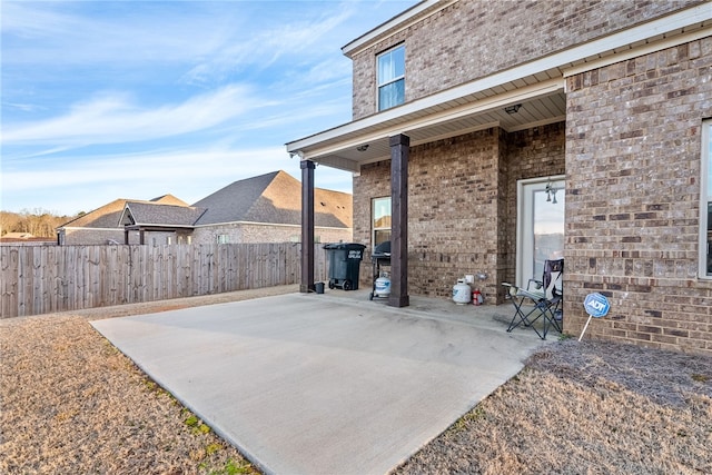 view of patio / terrace featuring fence