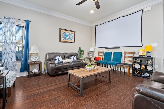 cinema featuring baseboards, ceiling fan, ornamental molding, and dark wood-type flooring