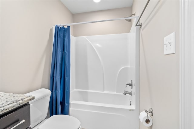 full bath featuring vanity, shower / bath combination with curtain, and toilet