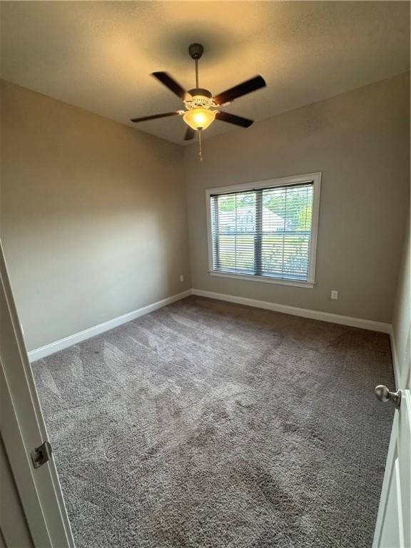856 Violet Ln, Opelika, AL 36801 - carpeted empty room with ceiling fan and baseboards