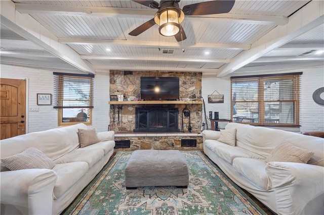 1701 Lee Road 353, Valley, AL 36854 - living area with plenty of natural light, a fireplace, ceiling fan, and a wooden ceiling with exposed beams