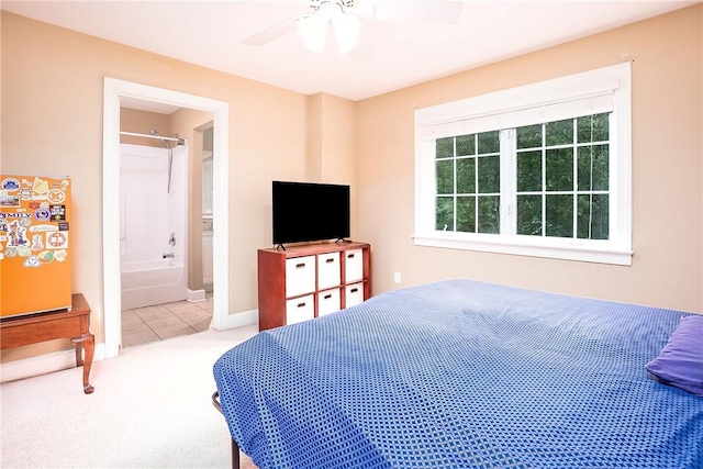 1957 Wire Rd Unit 21, Auburn, AL 36832 - carpeted bedroom with ceiling fan, tile patterned flooring, and connected bathroom
