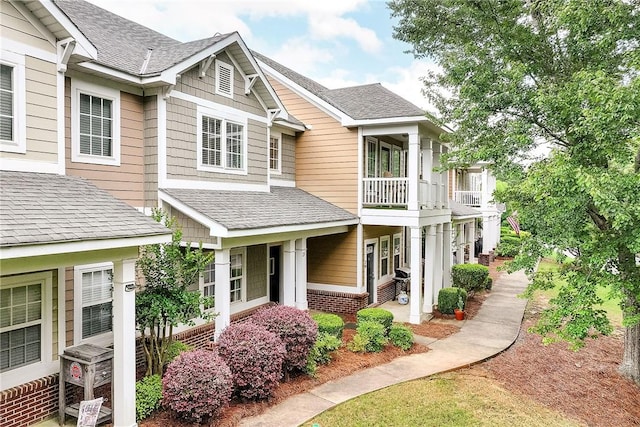 1957 Wire Rd Unit 21, Auburn, AL 36832 - view of front of home featuring a balcony, roof with shingles, and brick siding