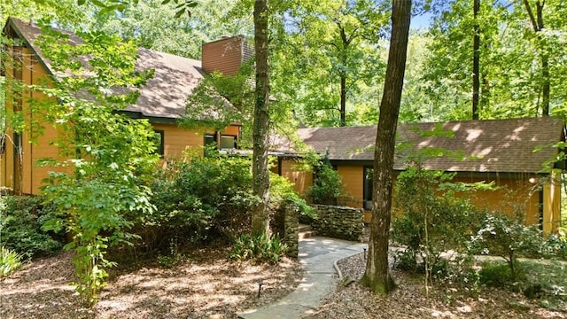 711 Oak Knoll Cir, Auburn, AL 36830 - chalet / cabin with roof with shingles and a chimney