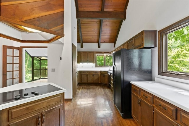 711 Oak Knoll Cir, Auburn, AL 36830 - kitchen featuring black appliances, dark wood finished floors, wooden ceiling, light countertops, and brown cabinetry