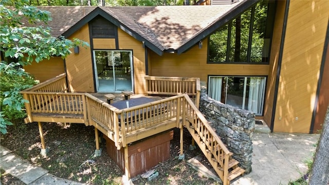 711 Oak Knoll Cir, Auburn, AL 36830 - rear view of property featuring a shingled roof, stairs, a wooden deck, and an attached garage