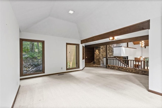 711 Oak Knoll Cir, Auburn, AL 36830 - unfurnished living room featuring carpet floors and vaulted ceiling
