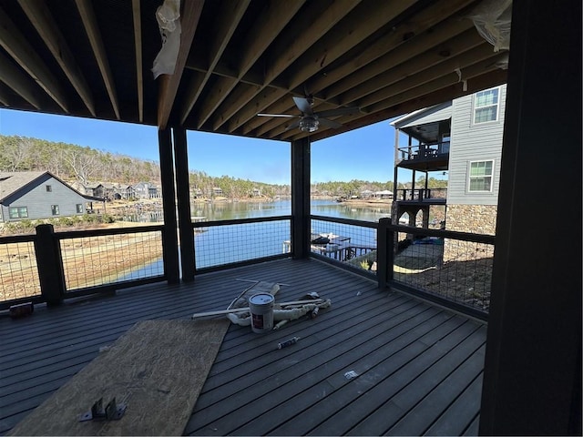 wooden terrace with ceiling fan and a water view